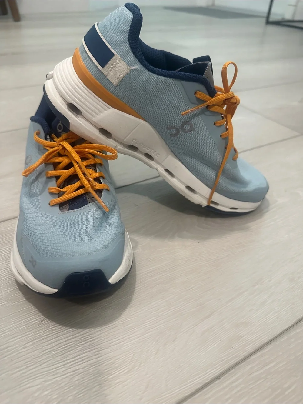 On Lightweight Women's Running Shoes in Light Blue and Orange